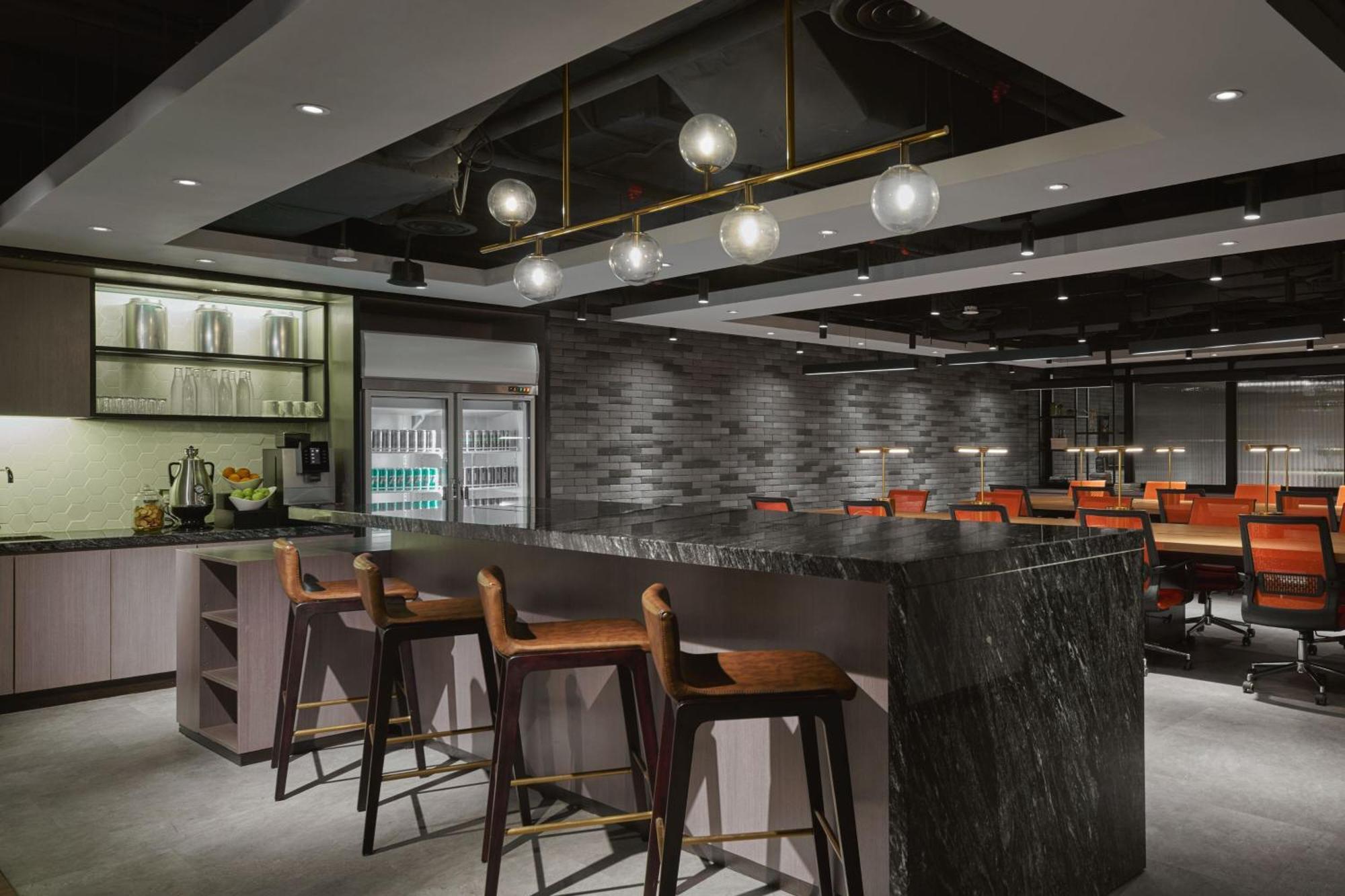 Jw Marriott Kuala Lumpur Hotel Exterior photo The photo displays a modern interior space featuring a stylish bar area. The bar has several high stools arranged along a dark, elegantly designed counter. Above the bar, there are pendant lights that provide warm illumination. The background shows a