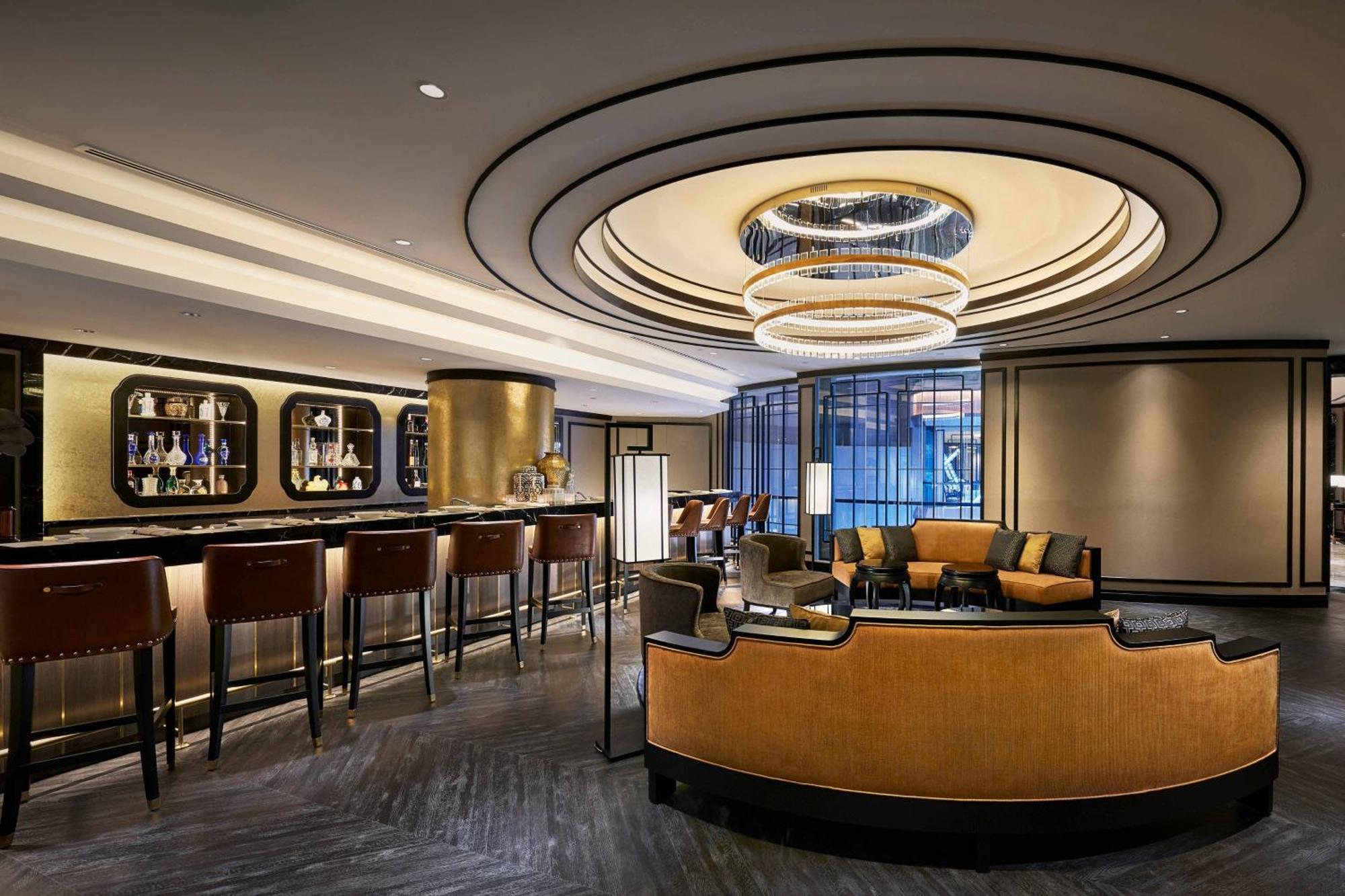 Jw Marriott Kuala Lumpur Hotel Exterior photo The photo depicts a stylish and modern lounge or bar area. It features an elegant design with a sophisticated color palette, including shades of gold and dark tones. 

Key elements visible in the image include:

- A circular ceiling design with a pro